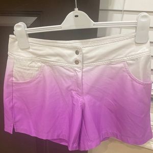 Slazenger tye-dye white and purple golf shorts.